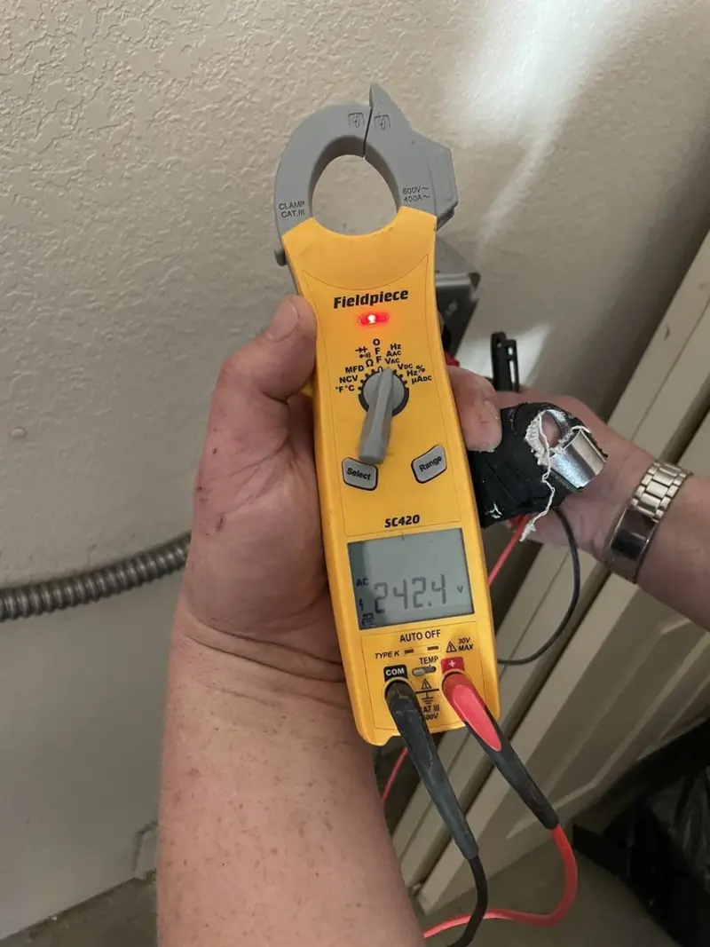 Voltage testing with clamp meter during Electrical Installation Services in San Diego Country Estates